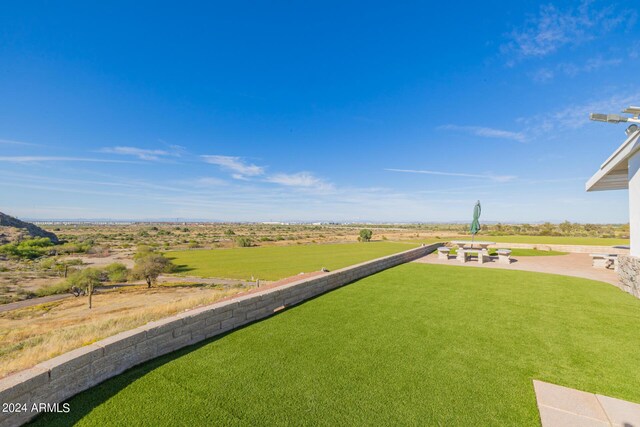 view of yard with a rural view