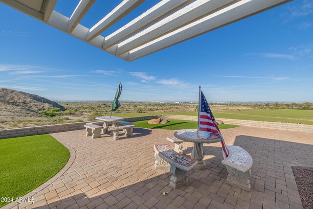 view of patio featuring a pergola