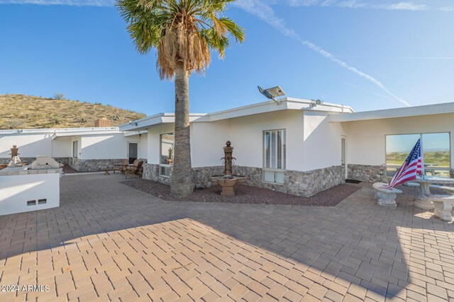 view of home's exterior featuring a patio area