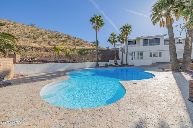 view of pool featuring a patio area