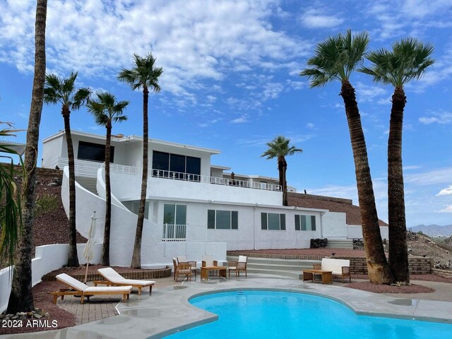 view of pool featuring a patio