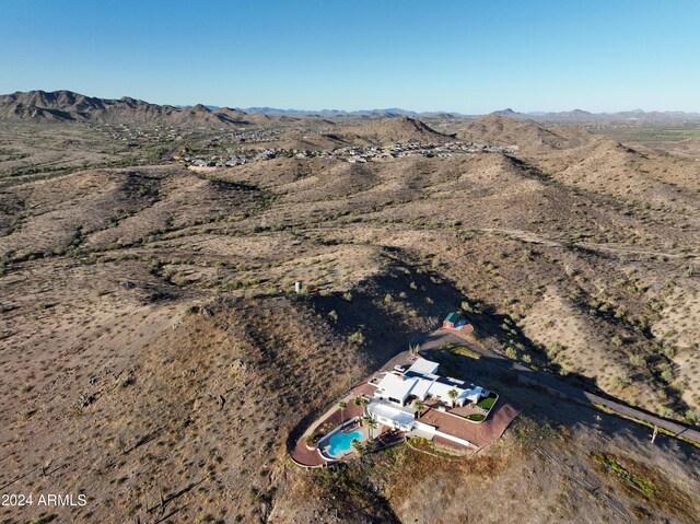 birds eye view of property with a mountain view