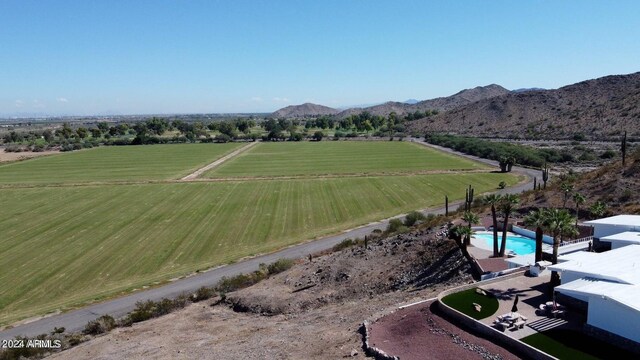 drone / aerial view featuring a mountain view and a rural view