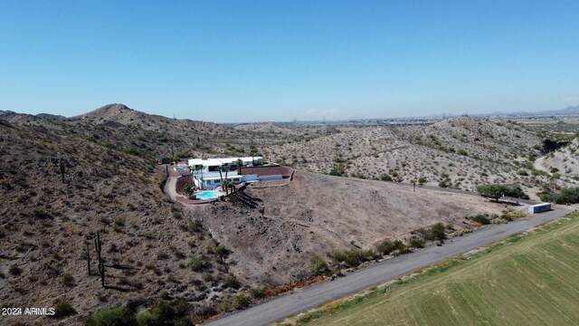 birds eye view of property featuring a mountain view and a rural view