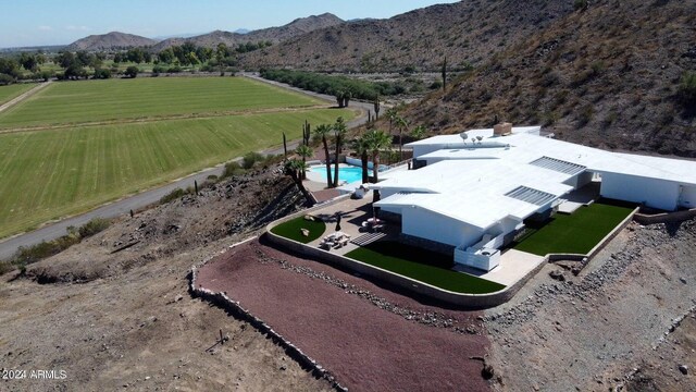 drone / aerial view featuring a mountain view and a rural view