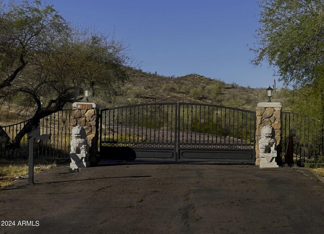 view of gate with a mountain view