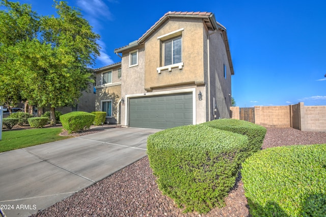 front of property with a garage