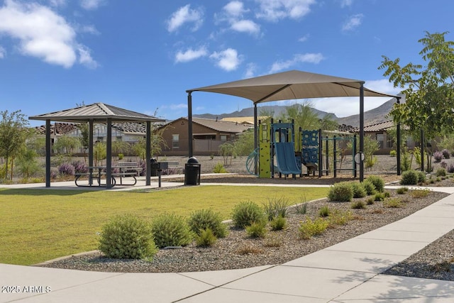 view of property's community with a playground, a gazebo, and a yard