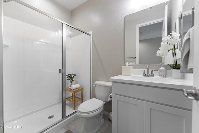 full bath featuring visible vents, a stall shower, toilet, and vanity