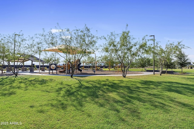 view of property's community with a gazebo, a lawn, and playground community