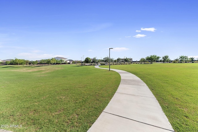 view of home's community with a lawn