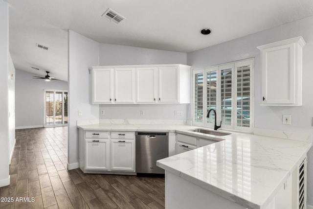 2015 E Glenhaven Dr, Phoenix, AZ 85048 - kitchen featuring stainless steel dishwasher, a sink, vaulted ceiling, white cabinets, and a peninsula