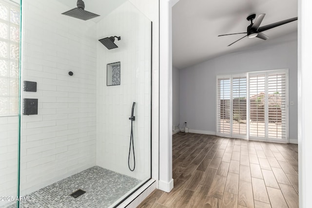 2015 E Glenhaven Dr, Phoenix, AZ 85048 - bathroom featuring lofted ceiling, a tile shower, ceiling fan, wood finished floors, and baseboards
