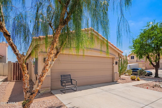 2015 E Glenhaven Dr, Phoenix, AZ 85048 - view of front of home featuring driveway, stucco siding, and a tiled roof