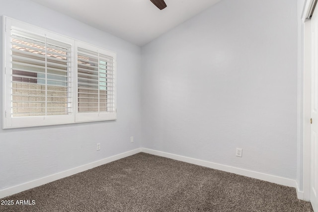 2015 E Glenhaven Dr, Phoenix, AZ 85048 - spare room with dark carpet, baseboards, ceiling fan, and vaulted ceiling