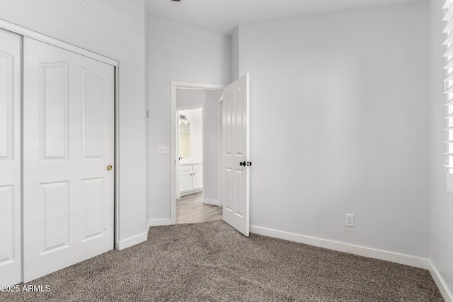 2015 E Glenhaven Dr, Phoenix, AZ 85048 - unfurnished bedroom with carpet flooring, baseboards, and a closet