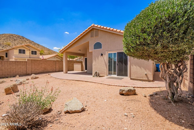 2015 E Glenhaven Dr, Phoenix, AZ 85048 - back of property with stucco siding, a patio, a fenced backyard, and a tiled roof