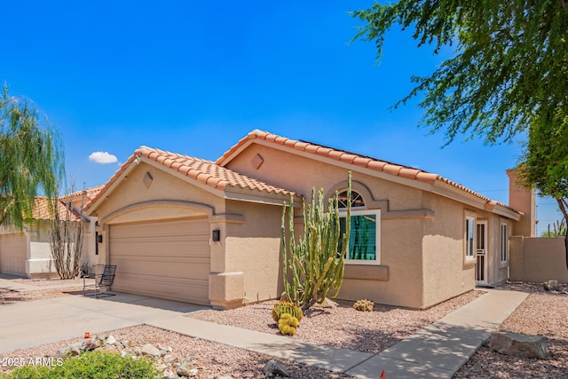 2015 E Glenhaven Dr, Phoenix, AZ 85048 - mediterranean / spanish-style home with a garage, stucco siding, concrete driveway, and a tile roof