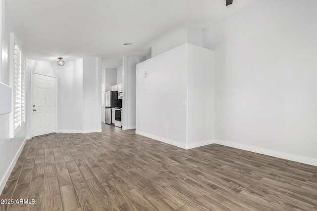 2015 E Glenhaven Dr, Phoenix, AZ 85048 - empty room with wood finished floors and baseboards