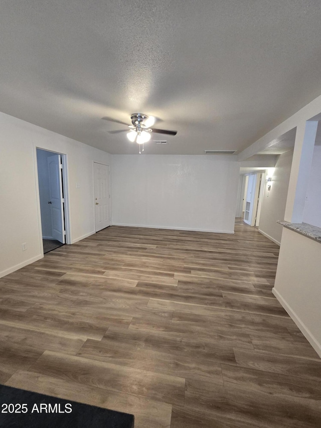 4911 W Merrell St, Phoenix, AZ 85031 - spare room featuring a ceiling fan, wood finished floors, and a textured ceiling