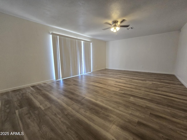 4911 W Merrell St, Phoenix, AZ 85031 - empty room with dark wood finished floors and ceiling fan