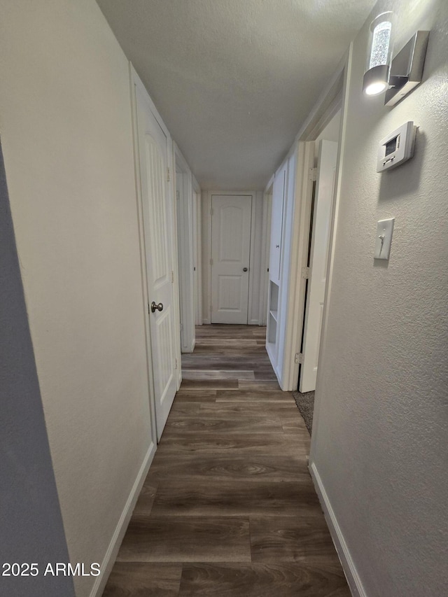 4911 W Merrell St, Phoenix, AZ 85031 - hall with dark wood-style flooring and a textured wall