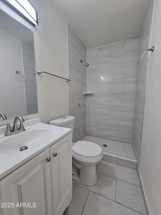 4911 W Merrell St, Phoenix, AZ 85031 - bathroom with tiled shower, vanity, and tile patterned flooring