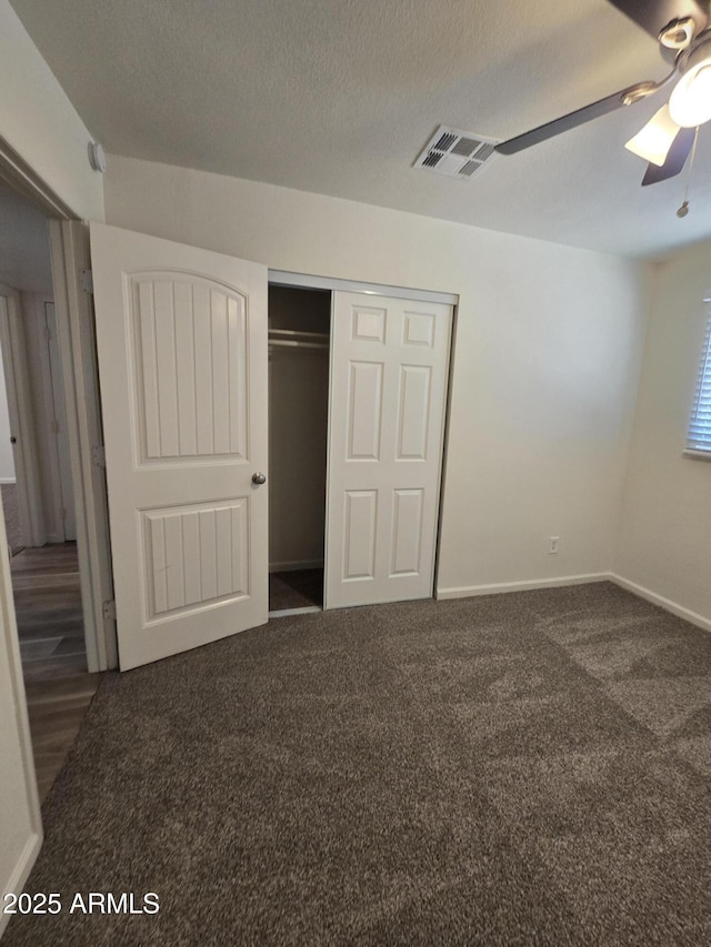 4911 W Merrell St, Phoenix, AZ 85031 - unfurnished bedroom with carpet, a closet, ceiling fan, and a textured ceiling