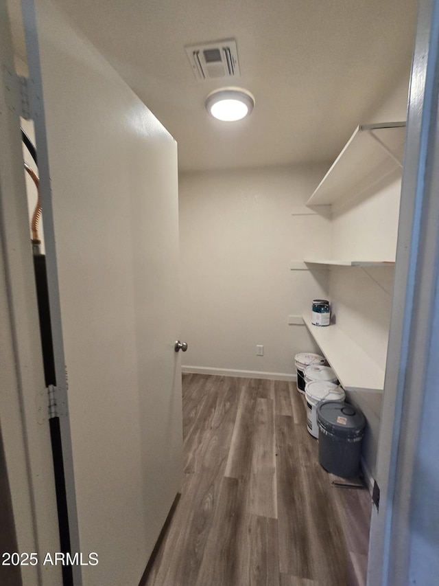 4911 W Merrell St, Phoenix, AZ 85031 - walk in closet featuring wood finished floors