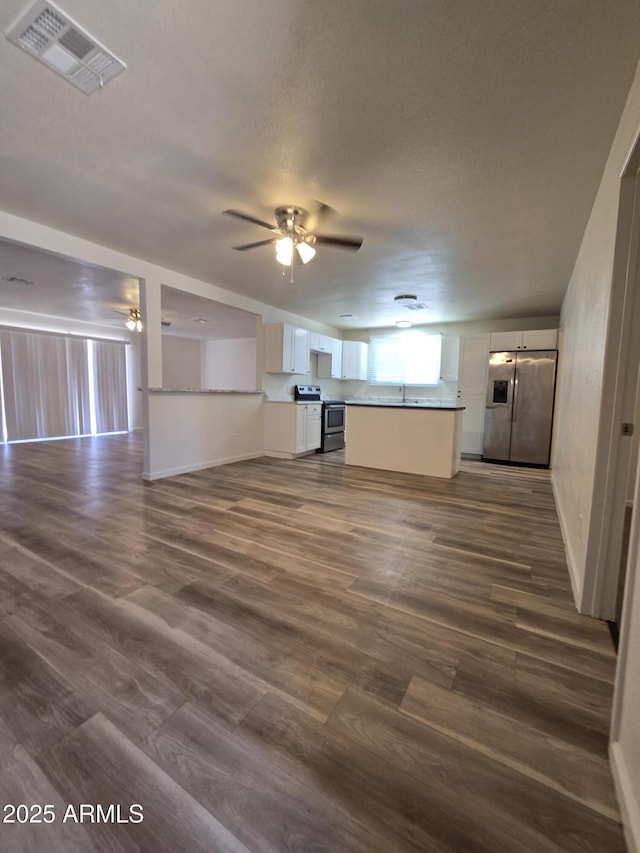 4911 W Merrell St, Phoenix, AZ 85031 - unfurnished living room featuring a ceiling fan and dark wood-type flooring