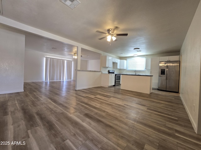 4911 W Merrell St, Phoenix, AZ 85031 - unfurnished living room featuring dark wood finished floors and ceiling fan
