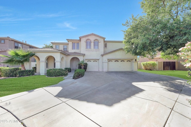 5726 W Park View Ln, Glendale, AZ 85310 - mediterranean / spanish home with stucco siding, driveway, and a tiled roof