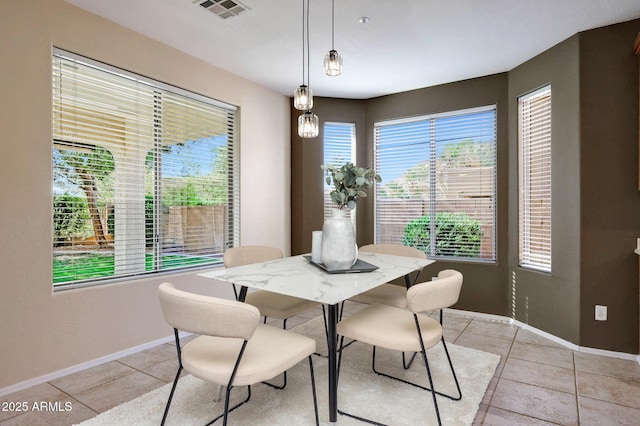 5726 W Park View Ln, Glendale, AZ 85310 - dining room featuring light tile patterned floors and baseboards