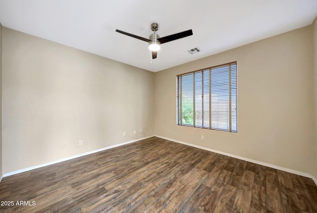 5726 W Park View Ln, Glendale, AZ 85310 - unfurnished room with dark wood-type flooring, ceiling fan, and baseboards