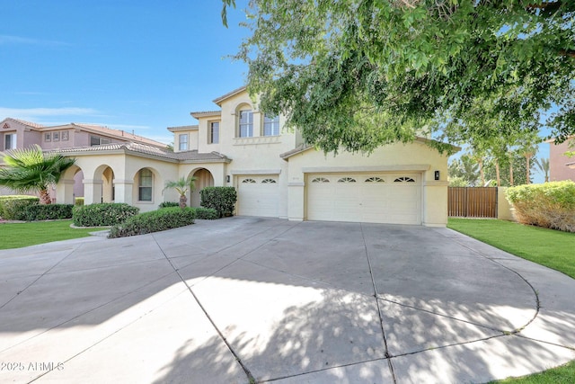 5726 W Park View Ln, Glendale, AZ 85310 - mediterranean / spanish-style house with stucco siding, driveway, and a garage