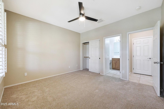 5726 W Park View Ln, Glendale, AZ 85310 - unfurnished bedroom featuring light colored carpet, baseboards, ensuite bath, and a closet