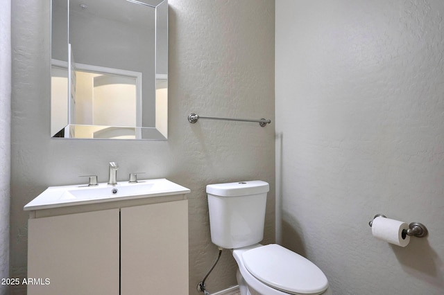 5726 W Park View Ln, Glendale, AZ 85310 - bathroom with toilet, a textured wall, and vanity