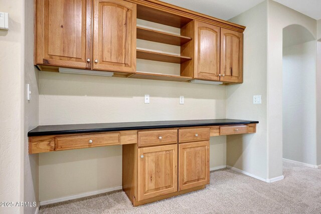 5726 W Park View Ln, Glendale, AZ 85310 - kitchen featuring light colored carpet, baseboards, open shelves, and dark countertops