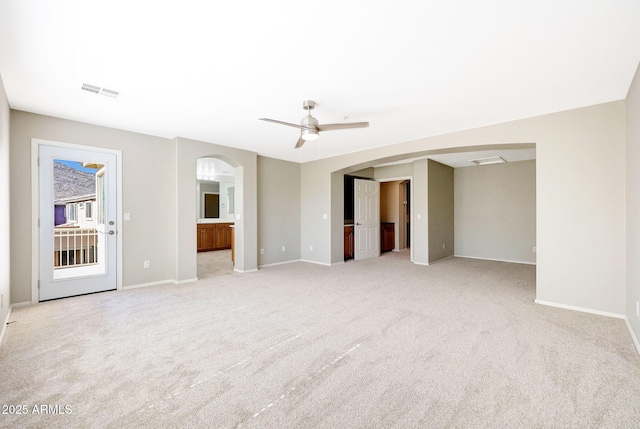 5726 W Park View Ln, Glendale, AZ 85310 - unfurnished bedroom with arched walkways, light colored carpet, and baseboards