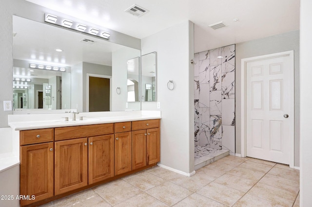 5726 W Park View Ln, Glendale, AZ 85310 - full bathroom with a tile shower, vanity, tile patterned flooring, and baseboards