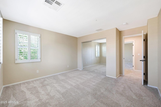 5726 W Park View Ln, Glendale, AZ 85310 - unfurnished bedroom featuring light colored carpet, a closet, and baseboards