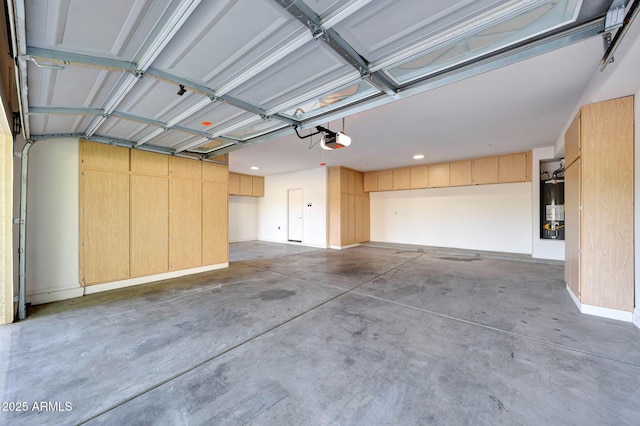 5726 W Park View Ln, Glendale, AZ 85310 - garage featuring water heater, a garage door opener, and recessed lighting