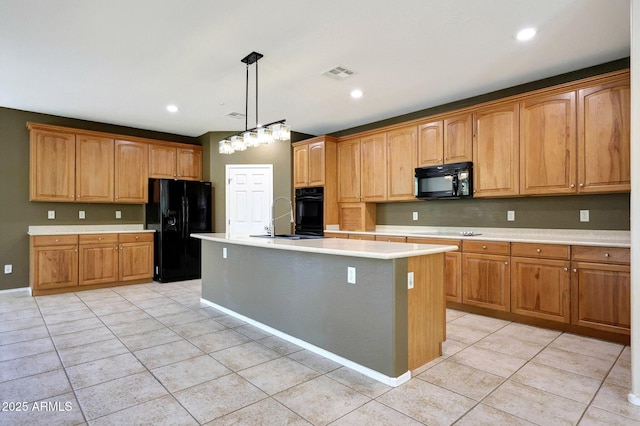 5726 W Park View Ln, Glendale, AZ 85310 - kitchen featuring black appliances, light countertops, light tile patterned floors, a sink, and an island with sink