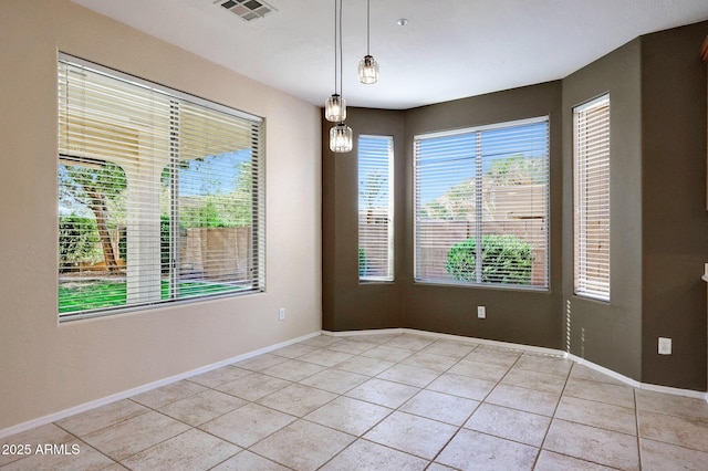5726 W Park View Ln, Glendale, AZ 85310 - empty room with light tile patterned floors and baseboards