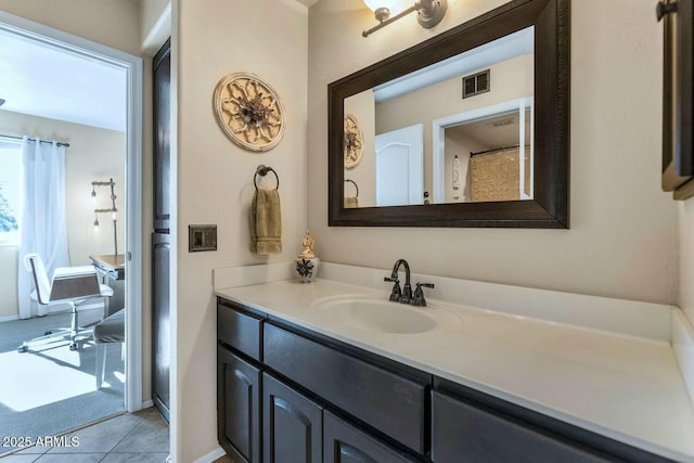 bathroom featuring vanity and tile patterned flooring