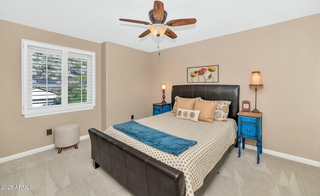 bedroom with ceiling fan and light colored carpet