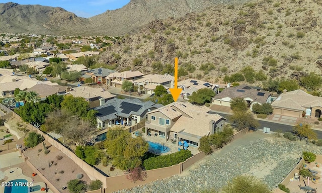 birds eye view of property featuring a mountain view