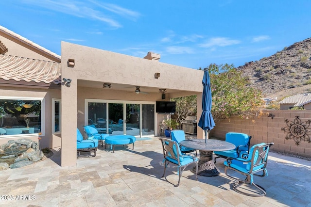 view of patio with ceiling fan