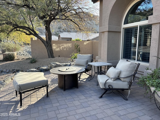 view of patio featuring an outdoor fire pit