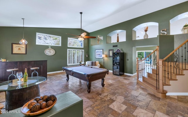 game room with ceiling fan, a high ceiling, and pool table